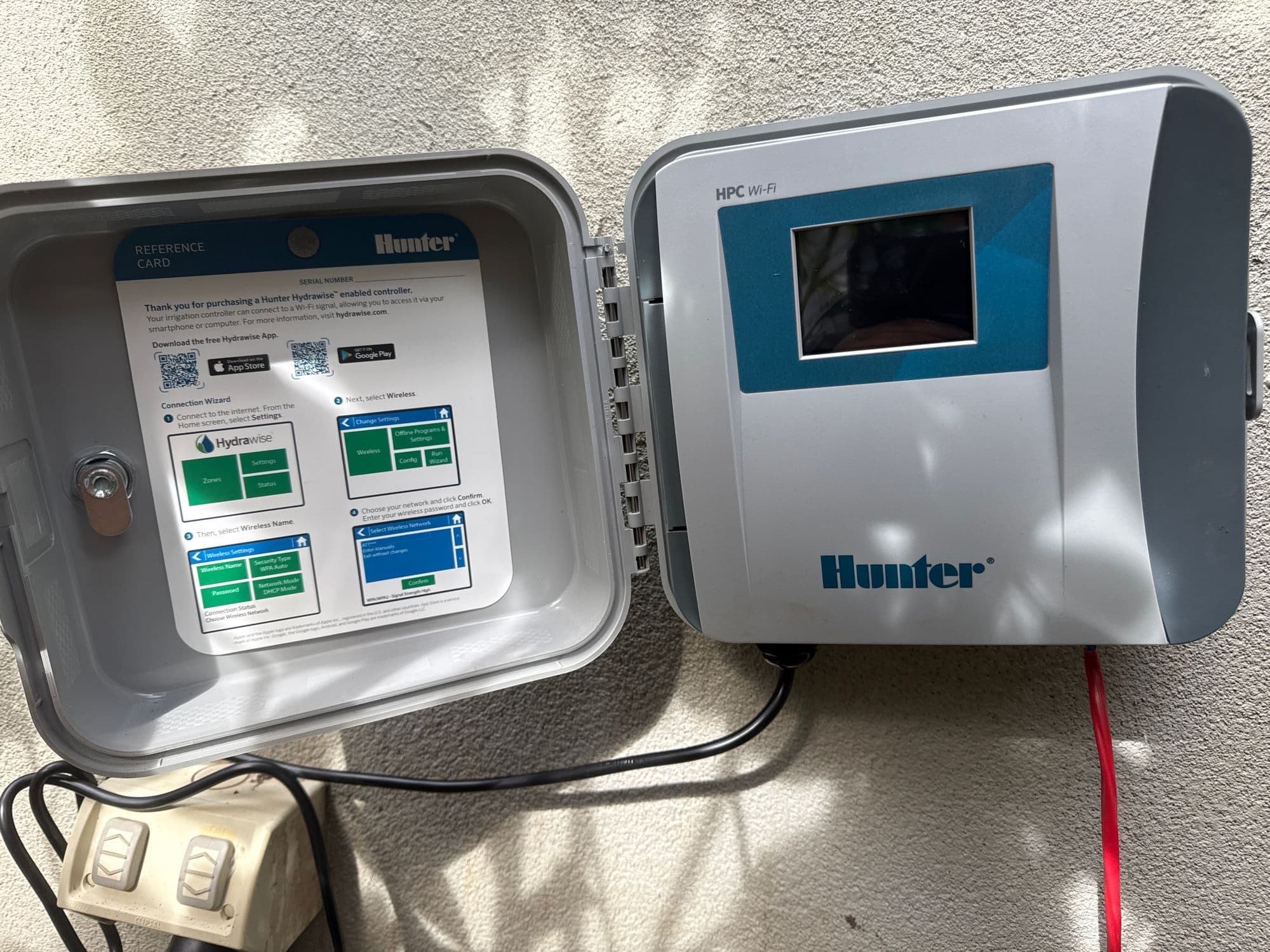 Hunter HPC wifi irrigation controller mounted on a wall