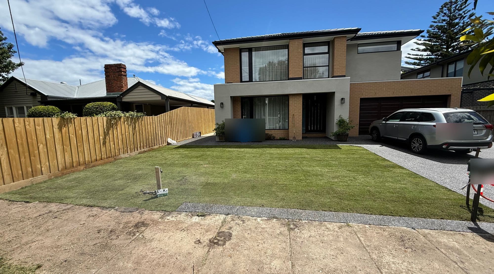 Finished Sir Walter buffalo front lawn behind a new timber fence in Cheltenham