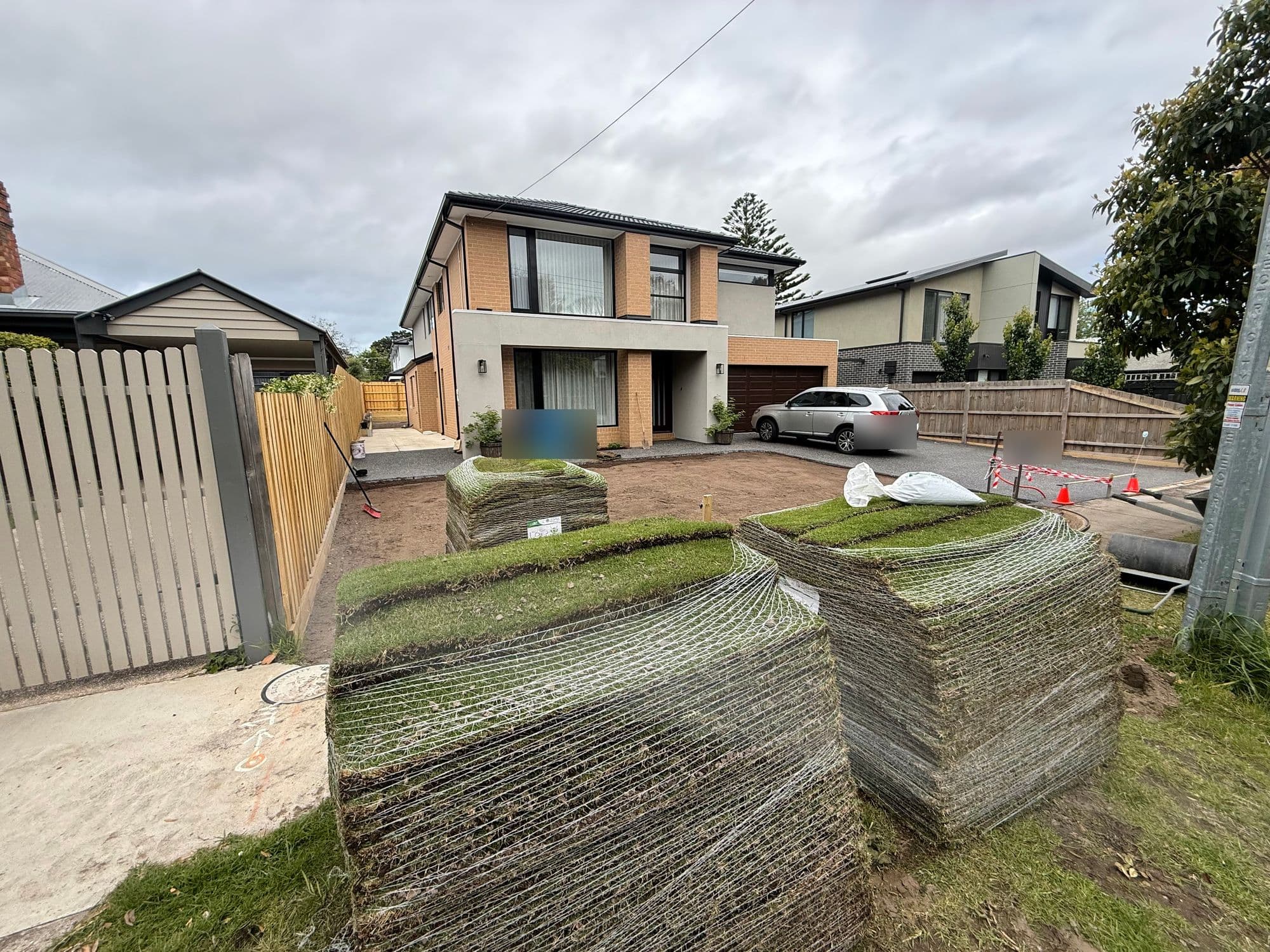 Pallets of Sir Walter buffalo turf delivered onto a prepared front yard in Cheltenham